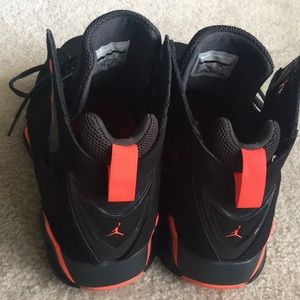 black and neon orange jordans